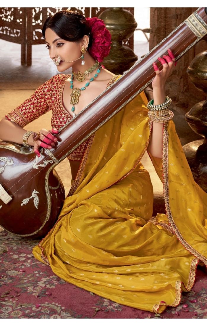 Styled model wearing yellow saree for Haldi or festive occasion